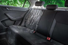 Protective foil under the car seat