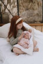Кукла реборн в розовой одежде, 40 см.