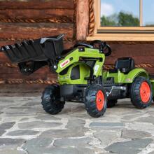 Falk Claas traktors ar piekabi un pedāļa kausu